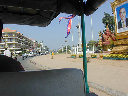 sisowath quay, and the ubiquitous royal portrait