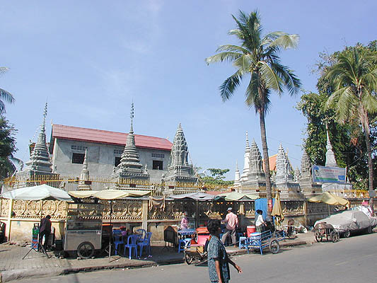 buddhist shrines behind street vendors