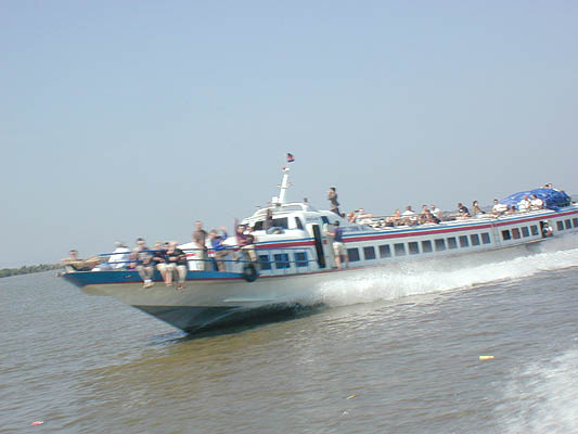 passing the downriver boat from siem reap