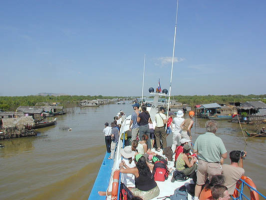 weaving through the floating village to the harbor