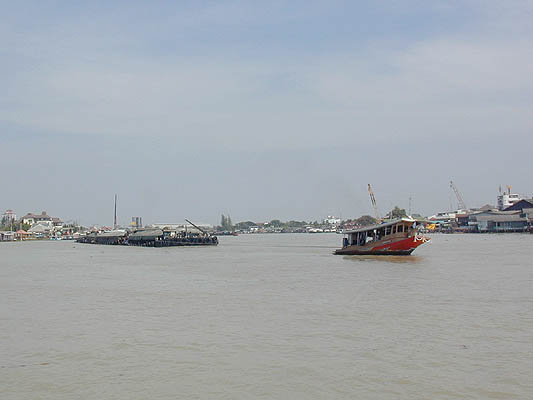 tug pulls a barge