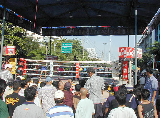 teens kickboxing at a local street fair