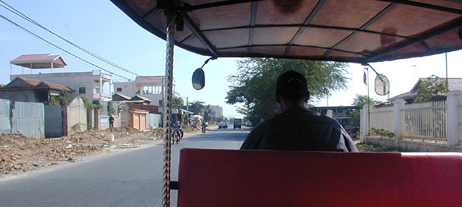 view from the back of a tuk-tuk, the ubiquitous scooter/trailer taxi