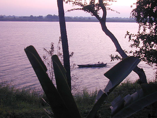 a fast boat skirts the shore