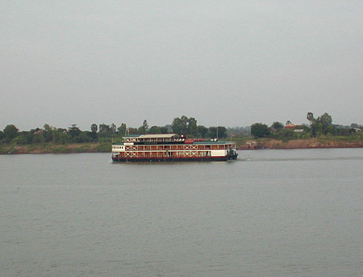 a party boat heading upstream