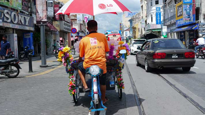 flower-decked pedicab